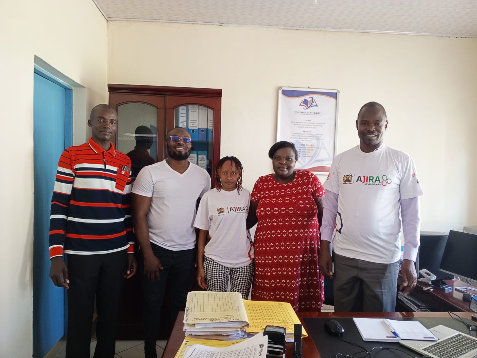 From Left: Ajira Team: Samuel Owino - Digital Curriculum Trainer Homabay county, Cliff Orina - Regional Coordinator Nyanza, Beatrice Mwangemi-Program Operations, Barbara Wekesa- Program Manager Training and Mentorship and Mr. Jared Malela Registrar Academic & Student Affairs(TMU)