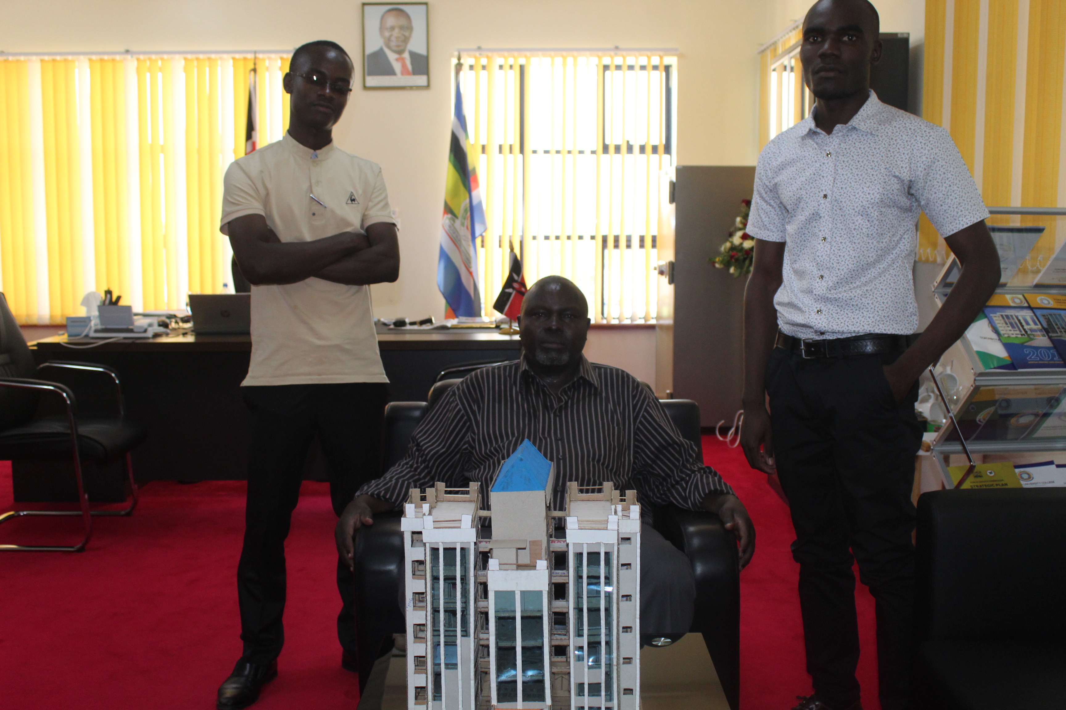 TMUC Principal, Prof. Charles Ochola with the Student Secretary General and the Innovative Student